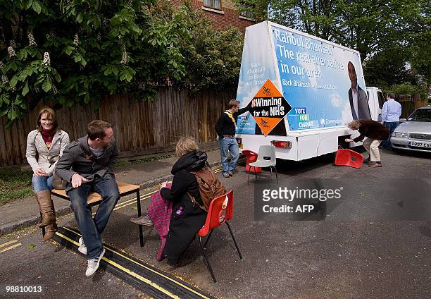 Liberal Democrat supporters attempt to block a van carrying a Conservative party poster from entering the area during a visit by Liberal Democrat...