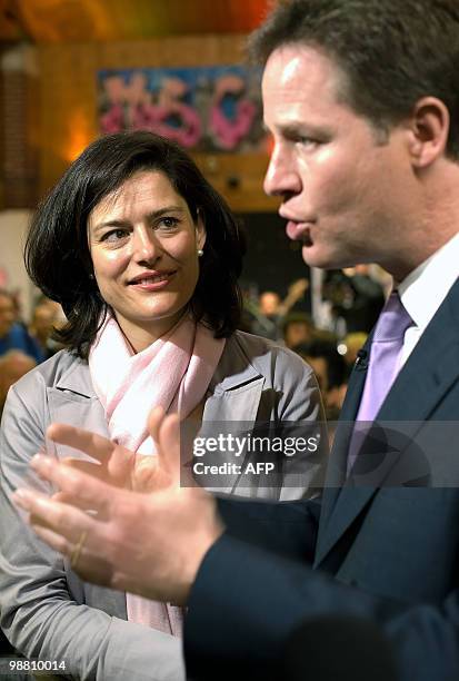 Liberal Democrat leader Nick Clegg speaks to the media as his wife Miriam Gonzalez Durantez looks on during a visit to the Palace Project community...