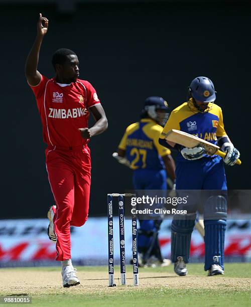 Elton Chigumbura of Zimbabwe celebrates the wicket of Tillakaratne Dilshan of Sri Lanka during the ICC T20 World Cup Group B match between Sri Lanka...