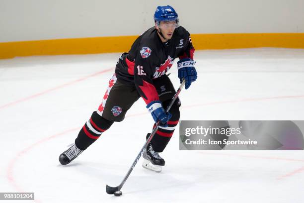 Canada Player Kyle Baun brings the puck out of defence at the 2018 Ice Hockey Classic between USA and Canada at Qudos Bank Arena on June 30, 2018 in...