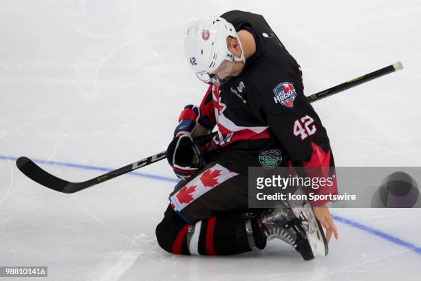 Canada Player Byron Froese checks his skate at the 2018 Ice Hockey Classic between USA and Canada at Qudos Bank Arena on June 30, 2018 in Sydney, NSW.