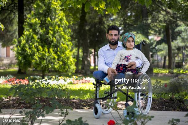 Syrian Maya Meri , who lost her legs during birth and since then started using artificial legs, which were made from pvc pipes and tin cans by her...