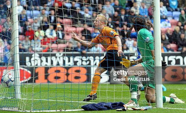 Hull City's Mark Cullen scores their second goal during their English Premier League football match against Wigan Athletic at The DW Stadium in...