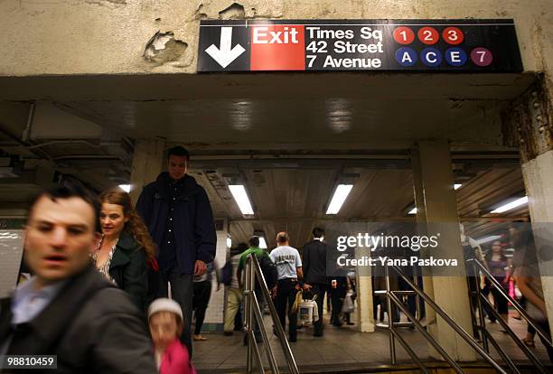 Pedestrians walk through the subway station on the corner of 42nd Street and 7th Avenue in Times Square May 3, 2010 in New York City. The area...