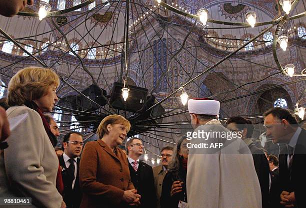 Mufti Mustafa Cagrici German Chancellor Angela Merkel listens to Mufti Mustafa Cagrici as she visits the Blue Mosque in Istanbul on March 30, 2010....