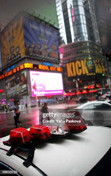 Pedestrians walk past the corner of 42nd Street and 7th Avenue in Times Square May 3, 2010 in New York City. The area resumed normal operations, with...