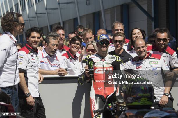 Cal Crutchlow of Great Britain and LCR Honda celebrates with team the second place at the end of the MotoGP Qualifying practice during the MotoGP...