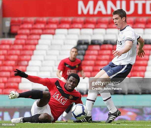Mame Biram Diouf of Manchester United clashes with Ciaran Clark of Aston Villa during the Barclays Premier Reserve League Play-Off match between...