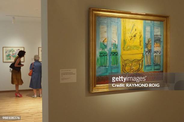 Visitor looks at the "La console jaune entre deux fenetres" painting by Raoul Dufy during the "les ateliers de Perpignan 1940-1950" exhibition at the...