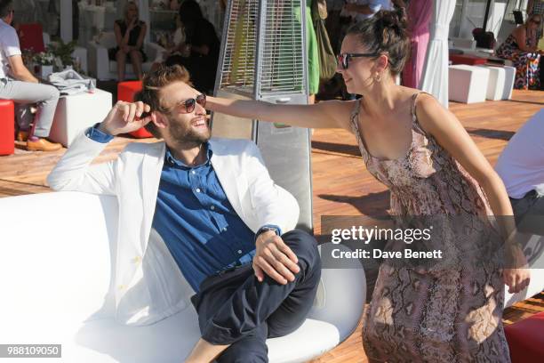 Douglas Booth and Bel Powley attend the Audi Polo Challenge at Coworth Park Polo Club on June 30, 2018 in Ascot, England.