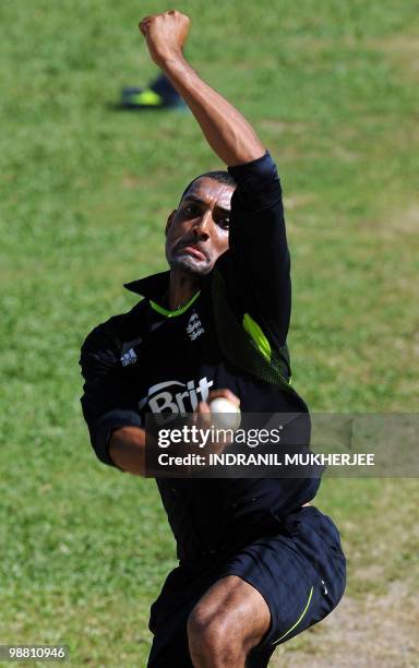 England cricketer Ajmal Shahzad bowls in the nets during a training session ahead of their ICC World Twenty20 match at the Providence Stadium in...