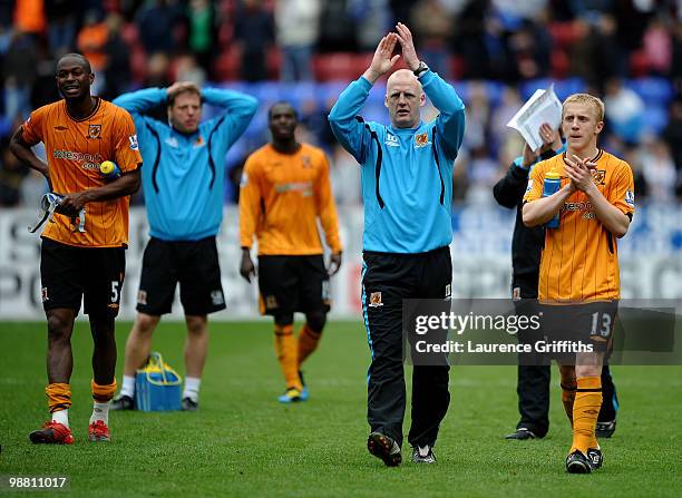Iain Dowie of Hull City applauds the fans afteralongside Mark Cullen during the Barclays Premier League match between Wigan Athletic and Hull City at...
