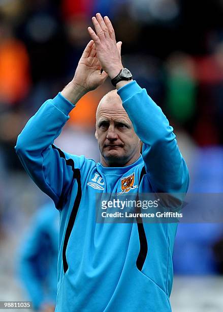 Iain Dowie of Hull City applauds the fans after his side is relagated during the Barclays Premier League match between Wigan Athletic and Hull City...