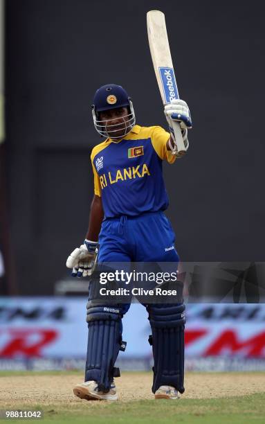 Mahela Jayawardene of Sri Lanka celebrates his century during the ICC T20 World Cup Group B match between Sri Lanka and Zimbabwe at the Guyana...