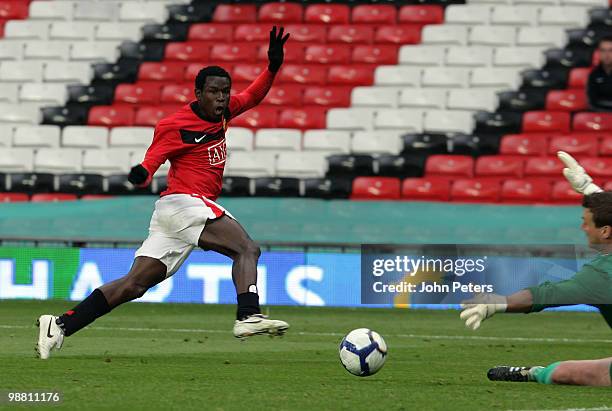 Mame Biram Diouf of Manchester United scores their first goal during the Barclays Premier Reserve League Play-Off match between Manchester United...