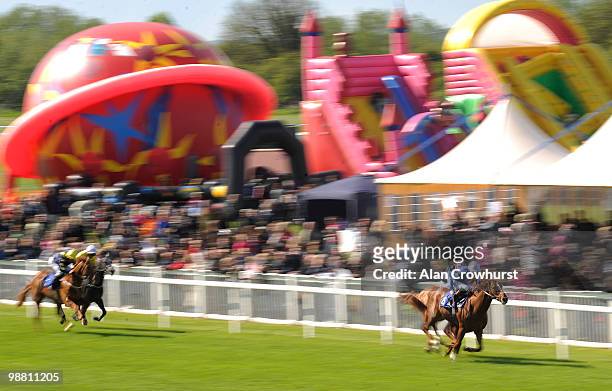 Suited And Booted and Richard Hughes win The Almond Resorts Premier All Inclusive Median Auction Maiden Stakes at Windsor racecourse on May 03, 2010...