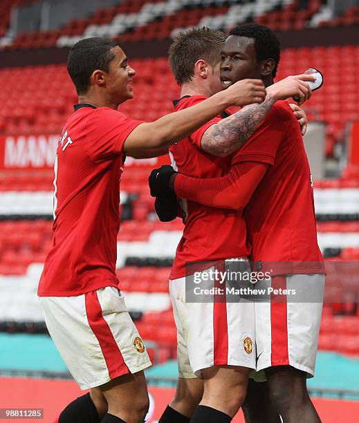 Mame Biram Diouf of Manchester United celebrates scoring their first goal during the Barclays Premier Reserve League Play-Off match between...