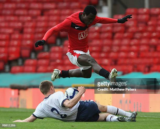 Mame Biram Diouf of Manchester United clashes with Matthew Roome of Aston Villa during the Barclays Premier Reserve League Play-Off match between...