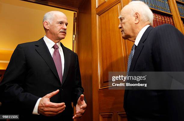 George Papandreou, Greece's prime minister, left, arrives for a meeting with Karolos Papoulias, Greece's president, at the presidential palace in...