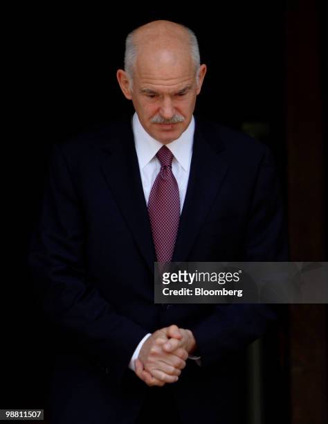 George Papandreou, Greece's prime minister, exits his office in Athens, Greece, on Monday, May 3, 2010. Papandreou's call for Greeks to accept more...