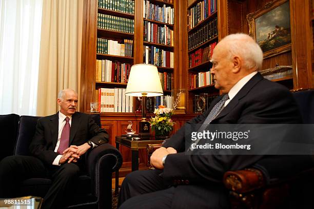 George Papandreou, Greece's prime minister, left, speaks during a meeting with Karolos Papoulias, Greece's president, at the presidential palace in...