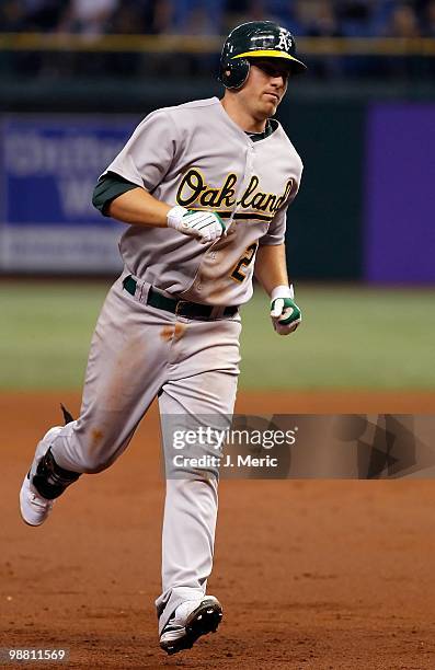 Shortstop Cliff Pennington of the Oakland Athletics rounds the bases after his home run against the Tampa Bay Rays during the game at Tropicana Field...