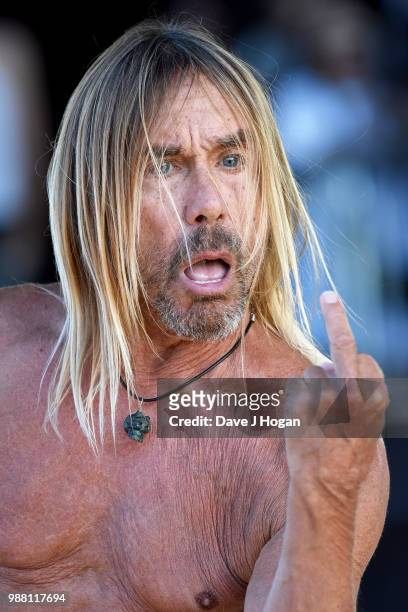 Iggy Pop supports Queens of the Stone Age on stage at Finsbury Park on June 30, 2018 in London, England.