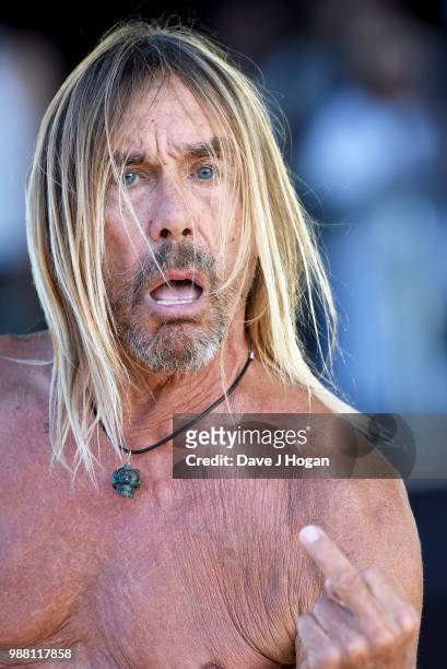 Iggy Pop supports Queens of the Stone Age on stage at Finsbury Park on June 30, 2018 in London, England.