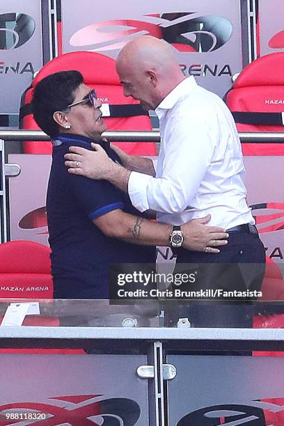 Diego Maradona embraces FIFA President Gianni Infantino following the 2018 FIFA World Cup Russia Round of 16 match between France and Argentina at...