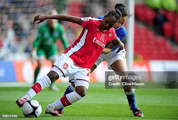 Danielle Carter of Arsenal is tackled during the Final of the FA Womens Cup, Sponsored by E.ON, between Arsenal and Everton at the City Ground on May...