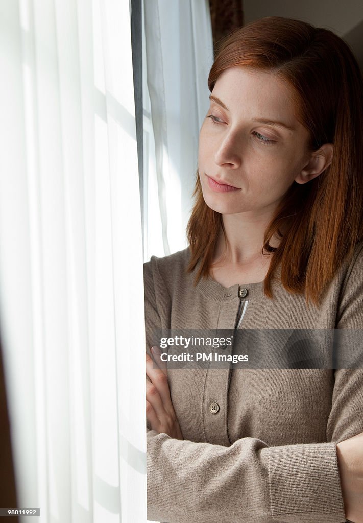 Woman looking out widow