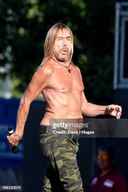 Iggy Pop supports Queens of the Stone Age on stage at Finsbury Park on June 30, 2018 in London, England.