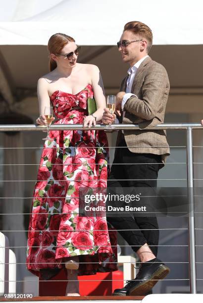 Eleanor Tomlinson and Ross Tomlinson attend the Audi Polo Challenge at Coworth Park Polo Club on June 30, 2018 in Ascot, England.