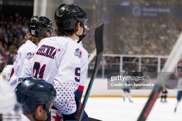 Player Shane Brennan watches the game from the bench at the 2018 Ice Hockey Classic between USA and Canada at Qudos Bank Arena on June 30, 2018 in...