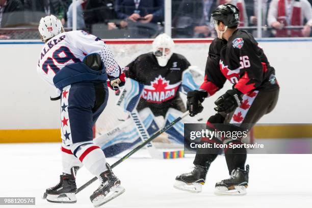 Player Nathan Walker takes a shot at the 2018 Ice Hockey Classic between USA and Canada at Qudos Bank Arena on June 30, 2018 in Sydney, NSW.
