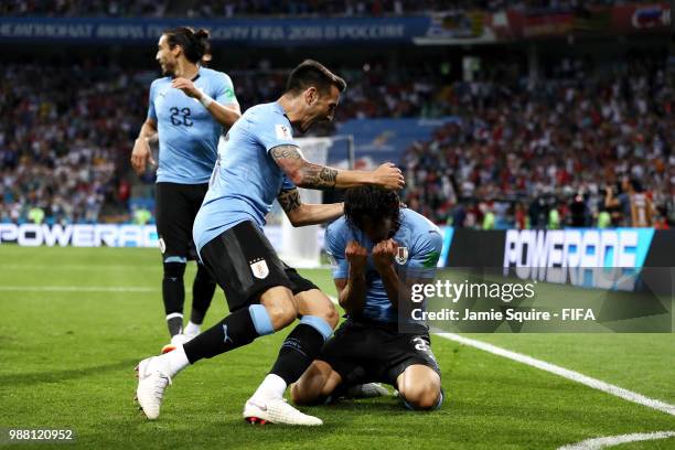 Edinson Cavani of Uruguay celebrates with teammates after scoring his team's first goal during the 2018 FIFA World Cup Russia Round of 16 match...
