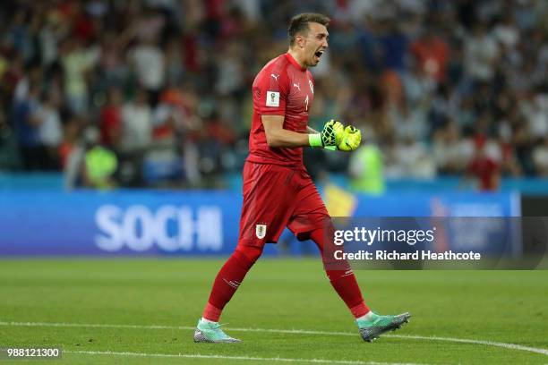 Fernando Muslera of Uruguay celebrates after teammates Edinson Cavani scores their team's first goal during the 2018 FIFA World Cup Russia Round of...