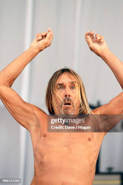 Iggy Pop supports Queens of the Stone Age on stage at Finsbury Park on June 30, 2018 in London, England.