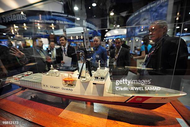 People view exhibits during the Navy League Sea-Air-Space Exposition at the Gaylord National Resort on the National Harbor, Maryland, on May 3, 2010....