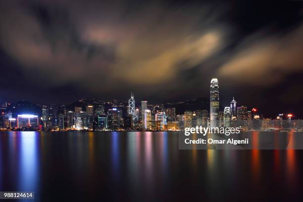 kowloon, hongkong -  hong kong harbor laser show to skyline - laser show stock pictures, royalty-free photos & images