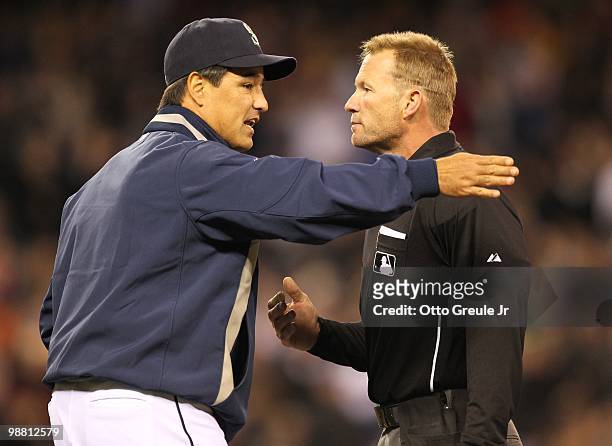 Manager Don Wakamatsu of the Seattle Mariners argues a call with umpire Jim Wolf against the Texas Rangers at Safeco Field on April 30, 2010 in...