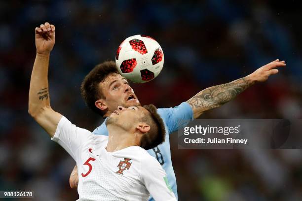 Nahitan Nandez of Uruguay wins a header over Raphael Guerreiro of Portugal during the 2018 FIFA World Cup Russia Round of 16 match between Uruguay...
