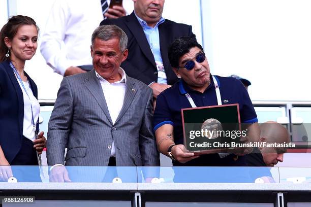 Diego Maradona receives an award ahead of kick-off during the 2018 FIFA World Cup Russia Round of 16 match between France and Argentina at Kazan...