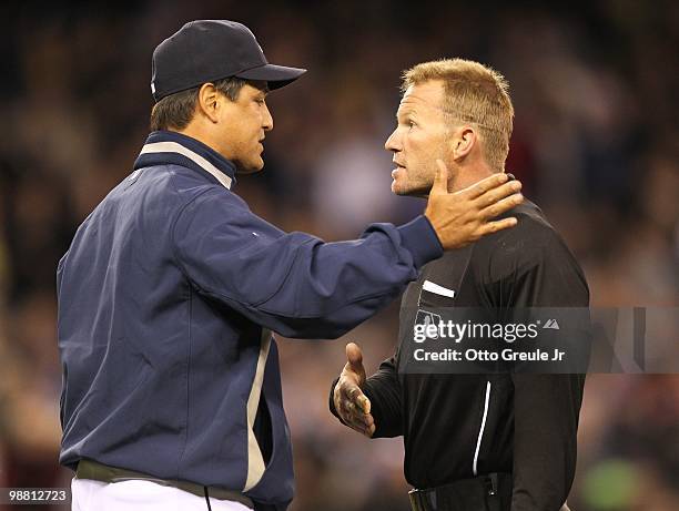 Manager Don Wakamatsu of the Seattle Mariners argues a call with umpire Jim Wolf against the Texas Rangers at Safeco Field on April 30, 2010 in...