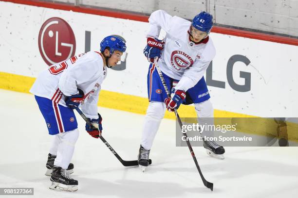 Montreal Canadiens Prospect Centre Jesperi Kotkaniemi waits in front of Montreal Canadiens Prospect Centre Ryan Hughes for the drill to begin during...