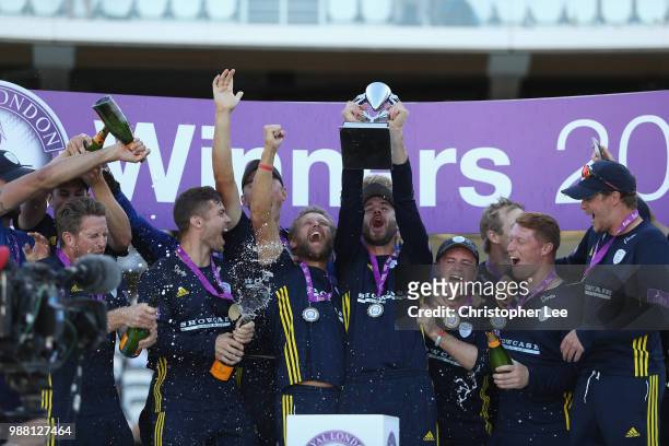 Captain James Vince of Hampshire lifts the Trophy as the team celebrate their victory during the Royal London One-Day Cup Final match between Kent...