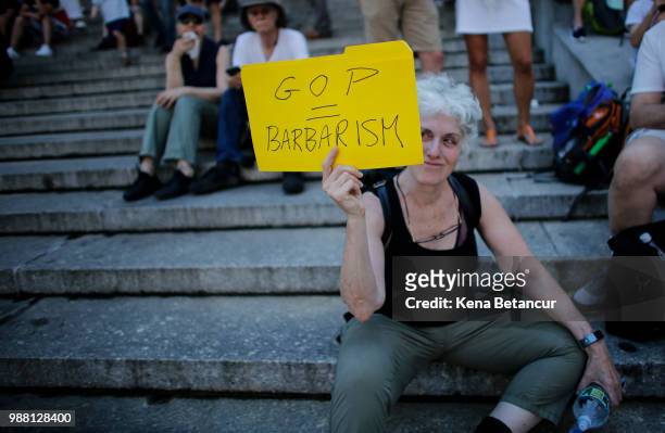 People take part in the nationwide "Families Belong Together" march on June 30, 2018 in New York City. As thousands of migrant children remain...