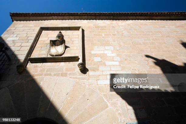 stone facade and coat of arms of carvajal palace, caceres, spain - carvajal stock pictures, royalty-free photos & images