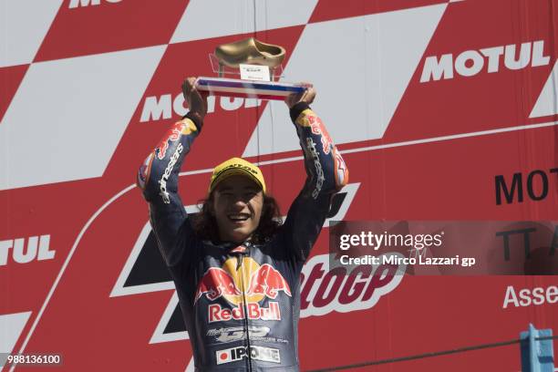 Can Oncu of Turkie celebrates the victory on the podium at the end of the Red Bull MotoGP Rookies Cup during the MotoGP Netherlands - Qualifying on...