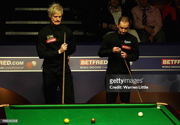 Graeme Dott of Scotland and Neil Robertson of Australia have a chat during the final of the Betfred.com World Snooker Championships at The Crucible...